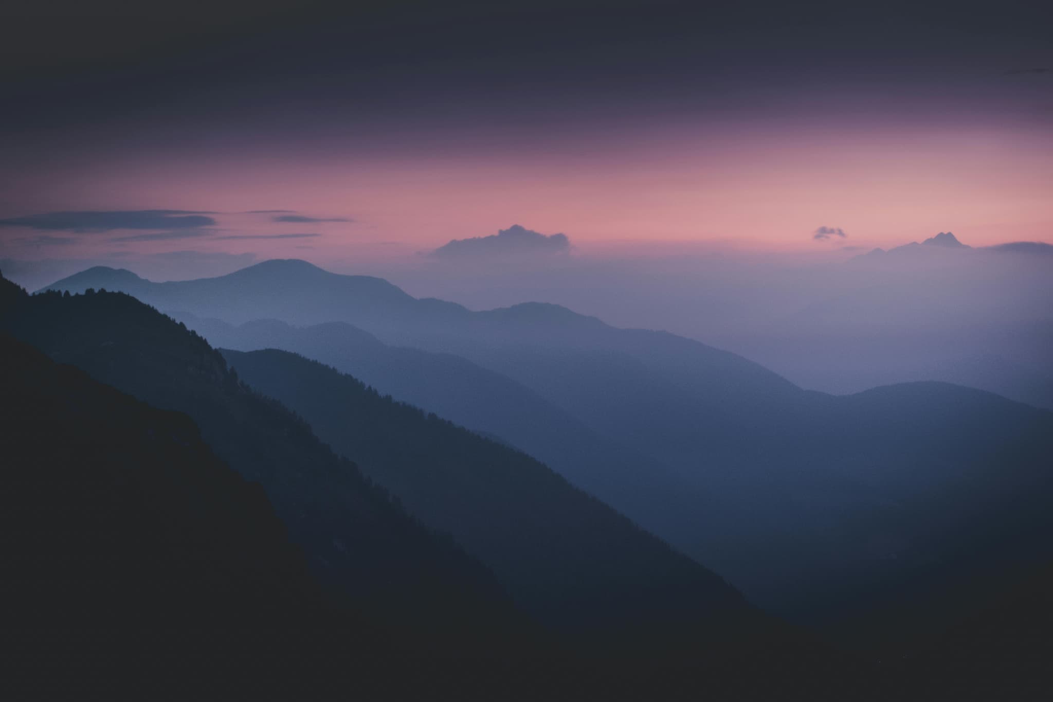 Silhouette of layers of mountains during dawn